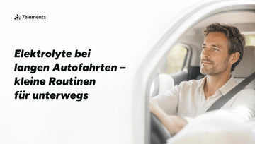 Mann am Steuer eines hellen Autos – Elektrolyte bei langen Autofahrten